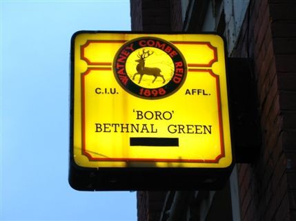 Bethnal Green Working Men's Club - The small but strikingly-coloured sign of the Bethnal Green Working Men's Club