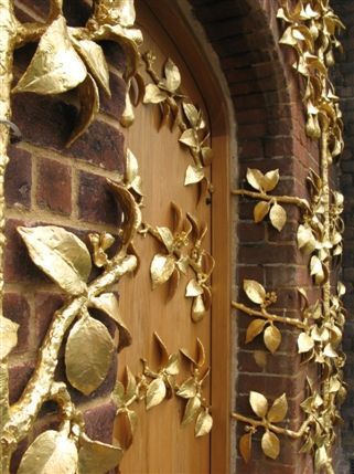 Hampton Court Palace - Golden-leafed gates at the entrance Hampton Court Palace - Golden-leafed gates at the entrance