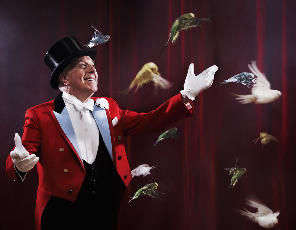 Zippos Circus: The Magnificent Top Hat - Norman Barrett and birds, photo by Phil Fisk